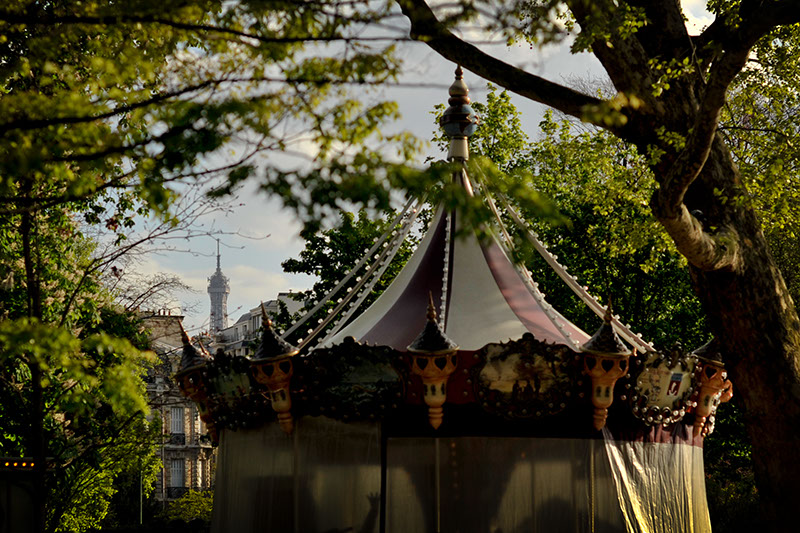 Unique view of Paris through trees to see the Tour Eiffel.