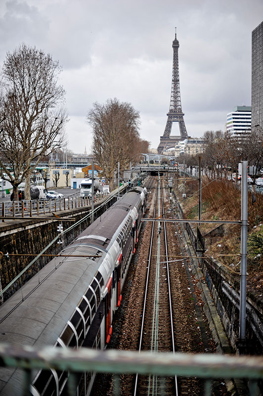 Watching a train arrive into Paris with the Eiffel Tower in the Background